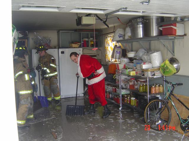 Santa’s helper lending a hand at a house fire 